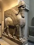 Lamassu, initially depicted as a goddess in Sumerian times, when it was called Lamma, it was later depicted from Assyrian times as a hybrid of a human, bird, and either a bull or lion—specifically having a human head, the body of a bull or a lion, and bird wings, under the name Lamassu.[92][93]