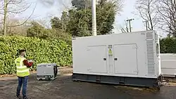An operator controlling a resistive 200kW Avtron load bank being used to test a diesel generator.