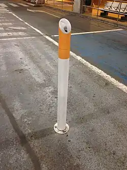A bollard that also serves as an ashtray at Brussels Airport