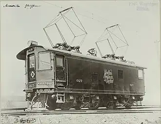 EP-1 boxcab locomotive with 2 AC pantographs raised to collect power from the overhead catenary. (Note the smaller DC pantograph in between the two)