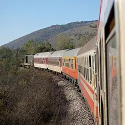 The Balkan Express near Pirot with a ŽS series 661 locomotive pulling. The train is running between the non-electrified section between Kalotina and Niš.