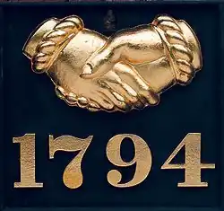 Gold leaf embellished Baltimore Equitable Society example. Unusually, the company still makes such fire marks and issues them to customers who want them.