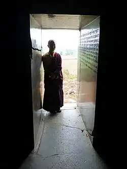 Entrance corridor, polished walls with the Gopika Cave Inscription of the 5th century CE.