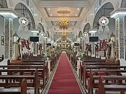 Church nave with parols hung, Christmas 2023