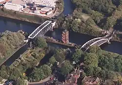 The swing aqueduct in the closed position, showing the Bridgewater Canal crossing over the Ship Canal. The Barton Road Swing Bridge is on the right