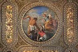 circular painting in set in gilded ceiling