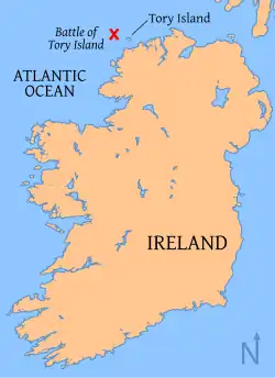 A map of a large beige island set in a blue sea with a red cross off the northwestern shoreline