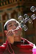 Blowing bubbles through a small wand