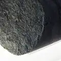 Gneiss sample bearing biotite and chlorite (green), a common alteration product of biotite.