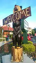 Carved wooden bear sign at a Black Bear Diner