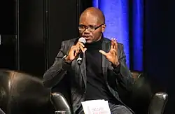 Man speaking into microphone