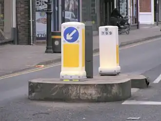 Internally illuminated traffic bollards direct vehicles to the appropriate side of an island in the United Kingdom