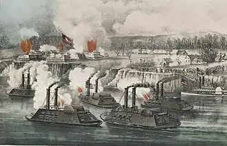 A lithograph depicting ironclad gunboats firing on a fort on a river bluff. Red flashes depict flames or explosions within the fort. To the right, lines of soldiers carrying the flag of the United States form around a cluster of buildings, preparing to advance against the fort.