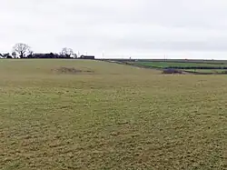 Group of three bowl barrows 180 m south of Tyning's Farm: part of the Tyning's Farm round barrow cemetery