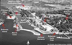 Oblique aerial view after Phase 1 (1950–1951) showing Crimson Cove and Mauve Cove now incorporated into the property of the BYC. Fill was used to dam the canal and to create the harbour entrance (1960).