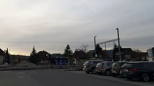 Parking lot in front of platform with shelter