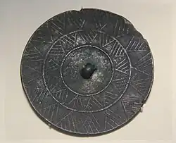 Bronze mirror, Gansu. Qijia culture (2400–1900) National Museum of China.