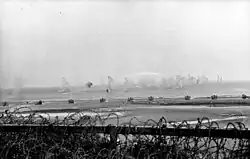 Shell splashes in the waters off Riva Bella (Sword Beach), May 30, 1944.