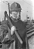 A brown coal miner with a pickaxe. West&nbsp;Germany, 1952