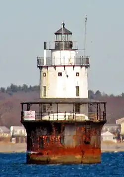 Butler Flats Light stands in open water about 15 feet (4.6 m) deep, about 1,800 feet (550 m) from land