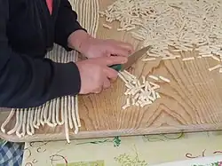 Cutting cavatelli into pieces