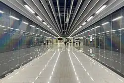 The “rainbow wall” refraction panel design of the concourse communication channel