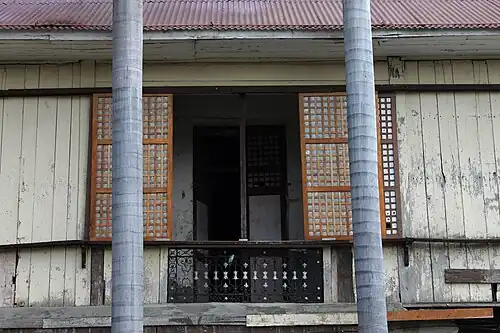 Traditional windows with sliding panes at the convent of Calasiao Church