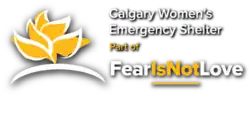 Yellow lotus with white highlights and text reading "Calgary Women's Emergency Shelter, part of Fear is Not Love