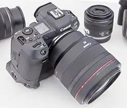 Canon EOS R5 with an RF 85mm f/1.2L USM lens, and extended battery pack base