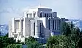 Modern photo of the cardston temple, with its signature Mayan-Aztek and Prairie School architecture style.