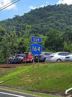 Southbound sign between Achiote and Naranjito barrio-pueblo