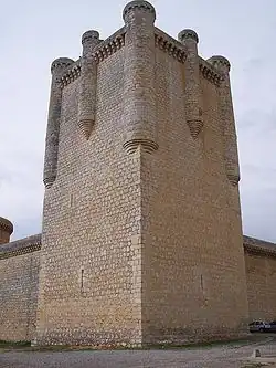 A stone tower at the corner of the defensive walls.