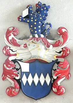 Detail of the heraldic achievement above the effigy