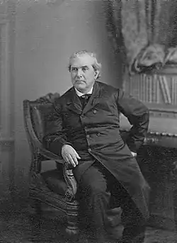 Three-quarter length seated portrait photograph of Charles H. Stonestreet