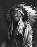 Chief In Full Headdress, Roland W. Reed