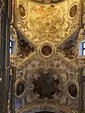 Baroque ceiling decorated with stuccoes and paintings