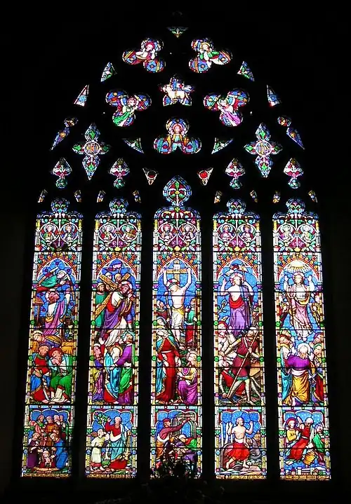 William Wailes. This window has the bright pastel colour, wealth of inventive ornament, and stereotypical gestures of windows by this firm. St Mary's, Chilham