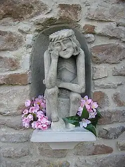 "Pensive Christ" (Chrystus Frasobliwy) at St Sigismund's Church, Szydlowiec, Poland