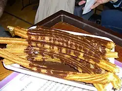 Churros drizzled with chocolate
