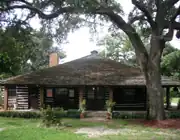 The historic Village Hall Log Cabin, which serves as Commission chambers for all meetings, as well as other Board meetings, and for special events.