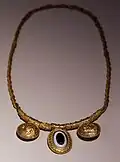 Gold necklace with bulle, 310-290 BC, from the tomb of gold in the necr. of the fishpond in todi