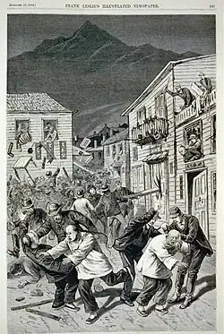 Wood engraving illustrating fighting in a street lined by wooden houses. White men in Western clothing are depicted assaulting Chinese men in traditional Manchu-style dress.