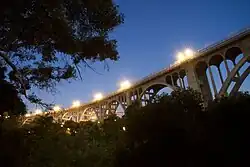 The Colorado Street Bridge 2020; view of side of bridge at night with lights on.