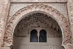 The decoration around the archway of the entrance iwan