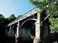 Disused railway bridge at the Crook o' Lune, once part of the "little" North Western Railway, now a cycle path[21]