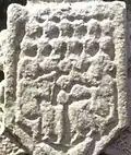 Kells South Cross. Asymmetrical lyre (accompanied by musicians playing double or triple pipes).