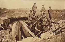German officers inspect a destroyed Belgian M1891 gun turret.