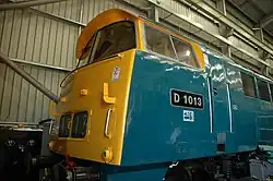 D1013 'Western Ranger' sits inside the shed at Kidderminster Depot on the Severn Valley Railway during the 2023 Spring Diesel Festival. This photo was taken during a guided tour of the depot. This photo showcases the state of the loco, which is currently being overhauled. The time on this photo is incorrect, as I forgot to change the clock on my camera for BST, however, for archival purposes I have kept the erroneous time. It was taken 1 hour later then shown.