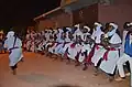 A group of Gnawas dance to a song.