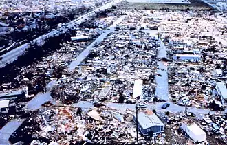 An aerial view of destroyed mobile homes with copious amounts of debris